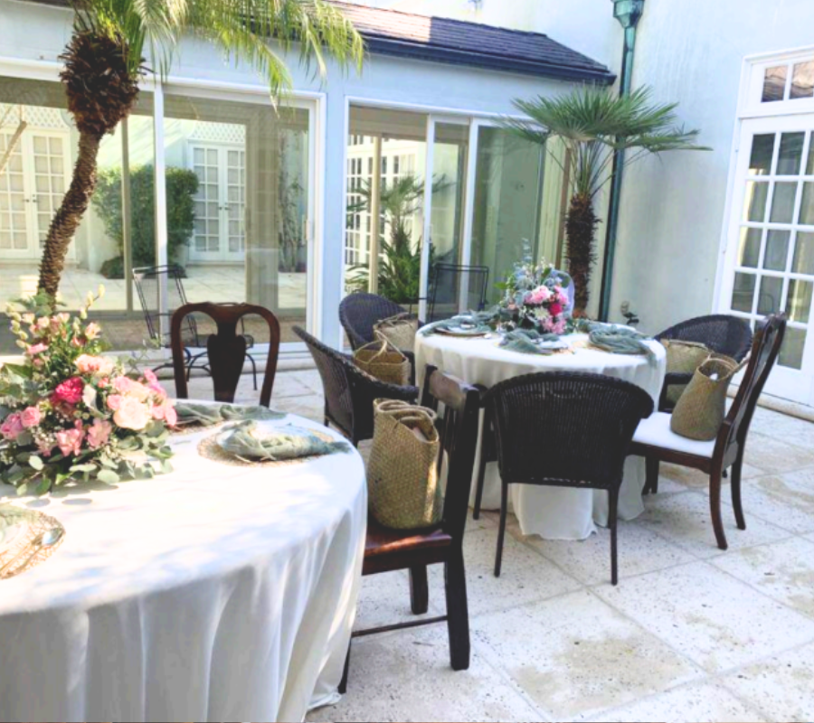 outdoor party with pink floral centerpieces